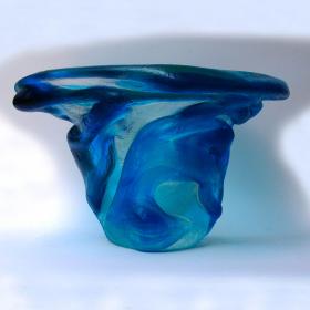 Angelo Rinaldi,  "Alghe", vaso scultura in vetro massello trasparente sovrapposizione di vetro celeste irregolare in rilievo su tutta la superfice, superficie acidata,  h. cm. 18x34,5x32, firma incisa, 1965.